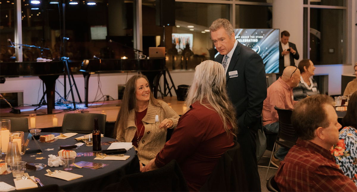 John Creekmur talking with attendees
